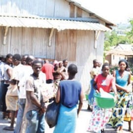 Women struggling with maize at ADMARC