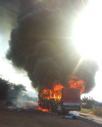Minibus hits and kills boy, mob burns bus