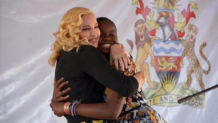 Madonna Hugging Mercy