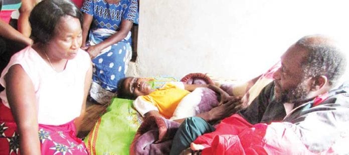 Minister Musa at Mgagada's sick bed