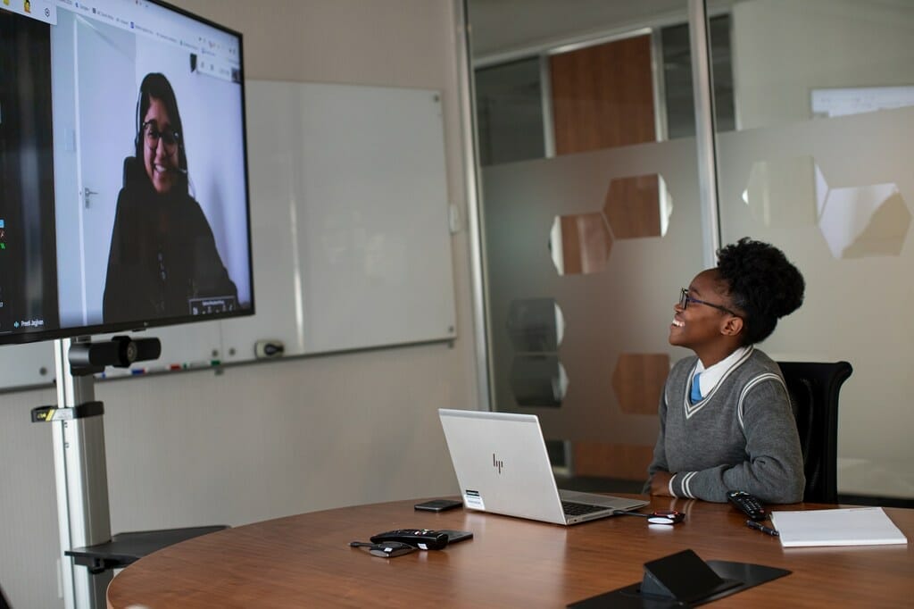 Sebabatso Nchephe (right), 18, chats remotely with her mentor, Pretty Jagivan (on screen) at the offices of Roche Pty Ltd in Sandton, South Africa. 