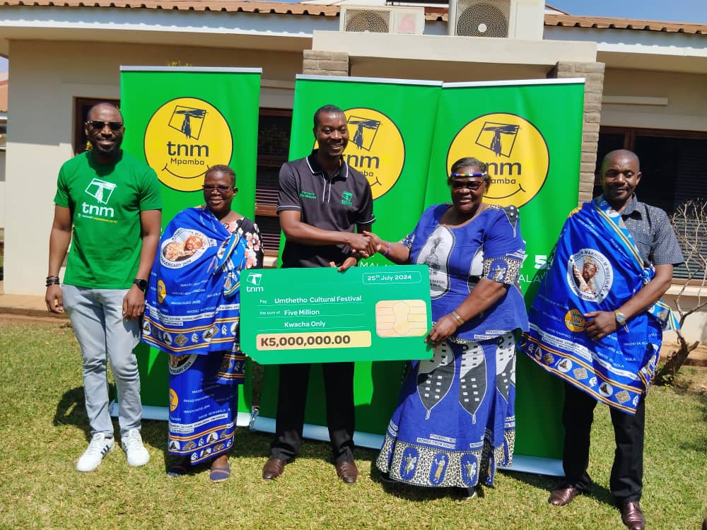 Ngwenya and Kalia (from left) receiving the donation